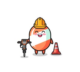 Naklejka premium road worker mascot of candy holding drill machine