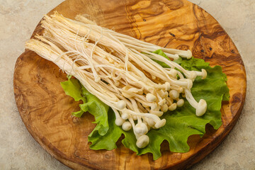 Raw Enoki mushrooms for cooking