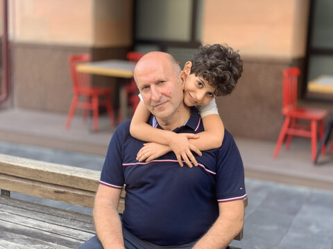 Cute Armenian Family Portrait Of Father And Son Hugging Each Other In Sharm El-Sheikh, Egypt