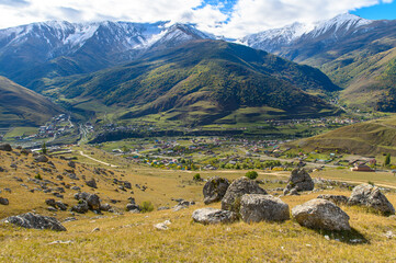 Mountain landscape with snow-capped peaks against the blue sky