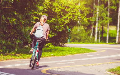 Cyclist ride on the bike path in the city Park
