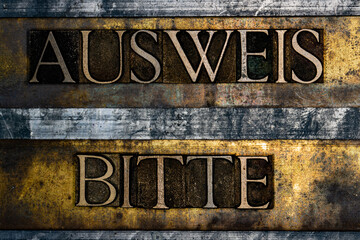 Ausweis Bitte text on textured grunge copper and vintage gold background