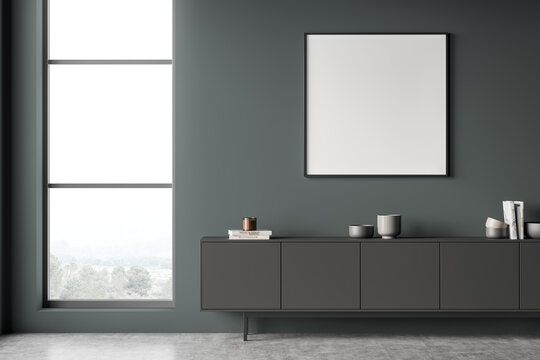 Square frame and grey sideboard on dark green living room wall