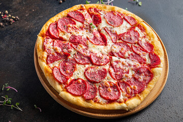 Pizza salami sausage pizza  pepperoni fast food cheese, tomato sauce, dough Takeaway fresh meal snack on the table copy space food background  pattern rustic 