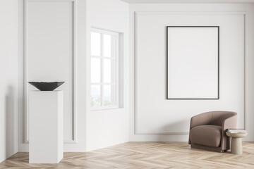 White living room with canvas on wall and beige armchair