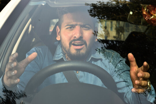 Indian man frustrated due to road rage, angry gesture 
