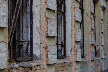 old abandoned premises, ruin. empty territories, abandoned houses. concept of war, Chernobyl disaster, apocalypse. brick buildings. sad view, heavy atmosphere, old broken windows