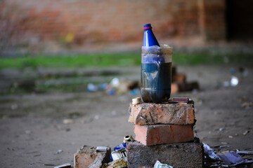 device for smoking marijuana. bong, homemade water bulbululator. drug addiction problem. copy space. Horizontal. hemp smoking device. two cut plastic bottles. abandoned building. close-up