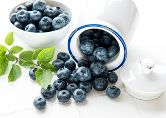 Blueberries on white tile  background
