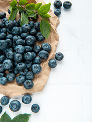 Blueberries on white tile  background