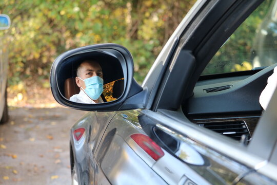 Covid  protected driver with facemark and suit