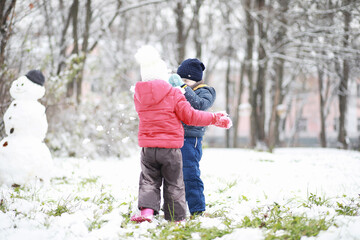 Children in winter park play