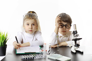 Young scientists chemists. Doctor, laboratory assistant.
