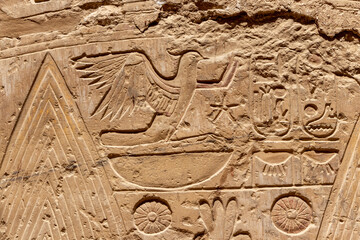 Ancient Egyptian murals and writings on the stone walls of the Karnak Temple in Luxor
