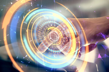 Double exposure of man's hands holding and using a digital device and tech theme hologram drawing. Technology concept.