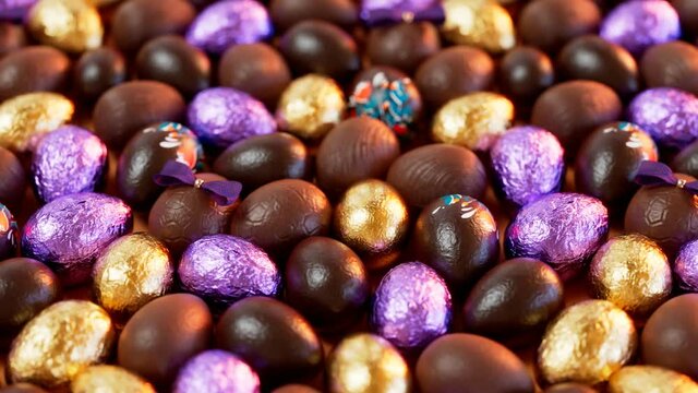 Adorable set of assorted chocolate Easter eggs. Shiny and colourful candies.