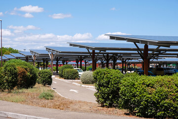 Solar panels on the parking lot near a supermarket on a sunny day in Avignon, Provence, France....