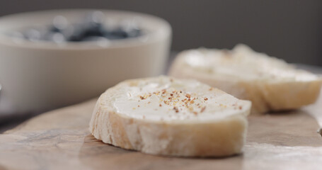 seasoning cream cheese on ciabatta