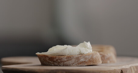 cream cheese on dark ciabatta slice