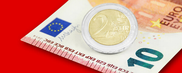 Mindestlohn 12,00 Euro auf rotem Hintergrund