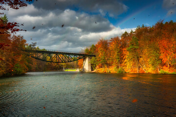 Naklejka premium Autumnal scenery and the railway bridge in Rutki, Kashubia. Poland