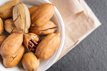 pecan nuts in shell fresh ingredient snack on the table copy space food background rustic vegan or vegetarian food