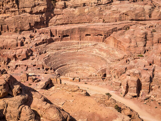 The Nabatean amphitheatre in the ancient city of Petra, Jordan. Theatre with row of seats and stairways carved into the side of the mountain. © Cristi