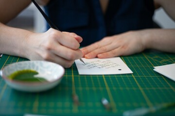 woman writing with caligraphy style