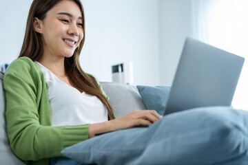 Close up of Asian business woman typing on computer and work at home. 