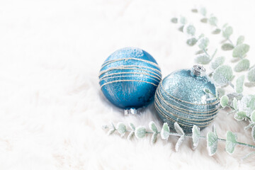 Golden christmas balls with wool background.