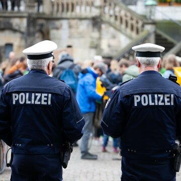 two german police watching protest