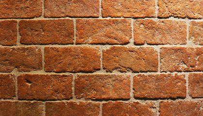 Red brick pattern texture background in dark light.