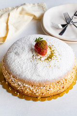 Strawberry cake on a white background. German cake filled with cream and strawberries