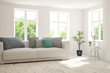 Minimalist living room in white color with sofa and summer landscape in window. Scandinavian interior design. 3D illustration