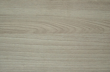 The brown wooden surface is professionally made and fitted. Floor, furniture, table, laminate, parquet, closeup.