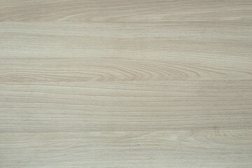 The light brown wooden surface is professionally made and fitted. Floor, furniture, table, laminate, parquet.
