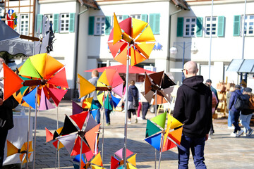 fair at the market square in the city center, artisans sell self-made goods, shoppers stroll...