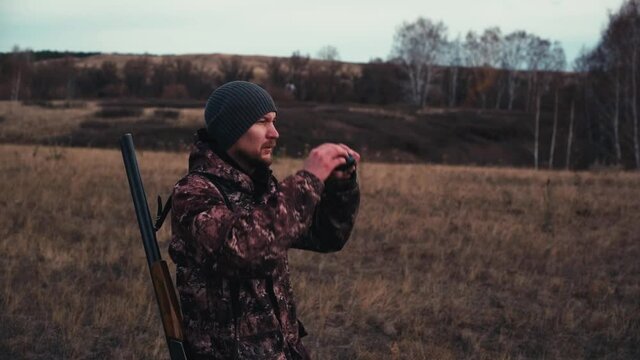 The hunter is looking into the benocle. Slow motion