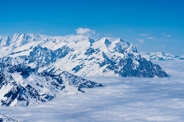 Obraz premium Switzerland, Panoramic view on Snow Alps and Blue Sky around Titlis mountain