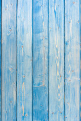 Naklejka premium Light blue wood texture background. Vertical photo
