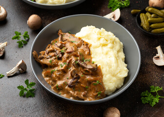 Beef Stroganoff with mushrooms and mashed potatoes.
