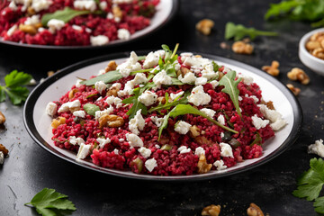 Bulgur salad with beetroot, walnuts, arugula and feta cheese. Healthy diet food