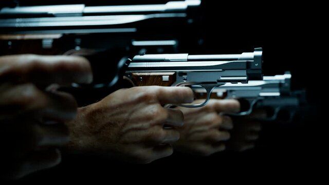 Guns in hands ready to shoot a target.  Shooting practice at the firing range.