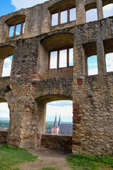 The ruins of the castle Landskrone in Oppenheim, Rheinhessen, Germany. Gothic Katarinenkirche in the window opening. Vertical image.