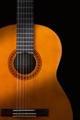Guitar on black vertical background. Classic acoustic guitar concept. Perfect for flyer, card,...
