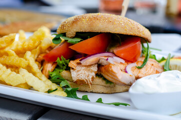 Grilled salmon sandwiches with french fries