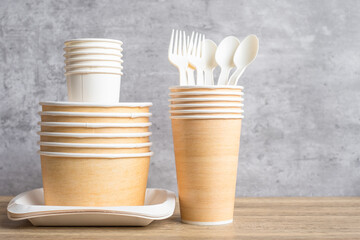 Eco friendly food packaging on table background. natural container: cup, plate, spoon and fork. zero waste, pollution, earth day, free plastic, world Environment day concept