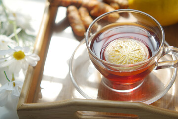 Top view of ginger tea on wooden background.