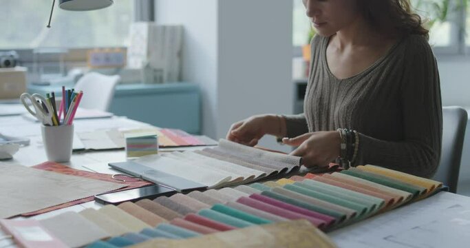 Professional decorator choosing fabric samples