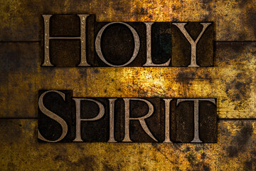 Holy Spirit text on textured grunge copper and vintage gold background